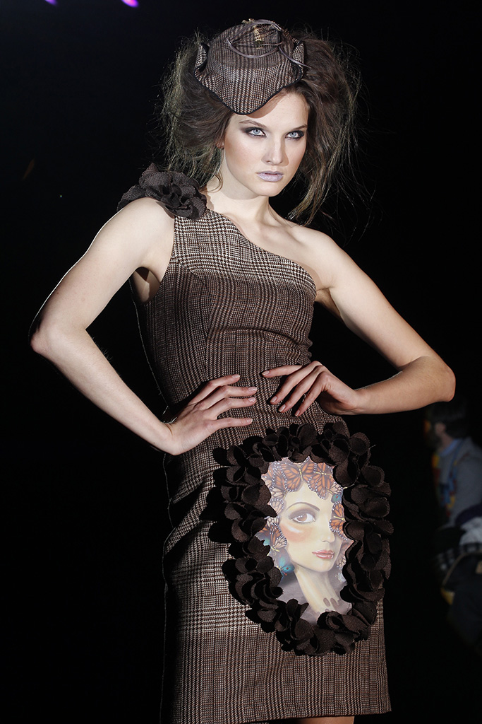 cat walk, model is posing in esther noriega's dress with leila ataya's painting printed on it